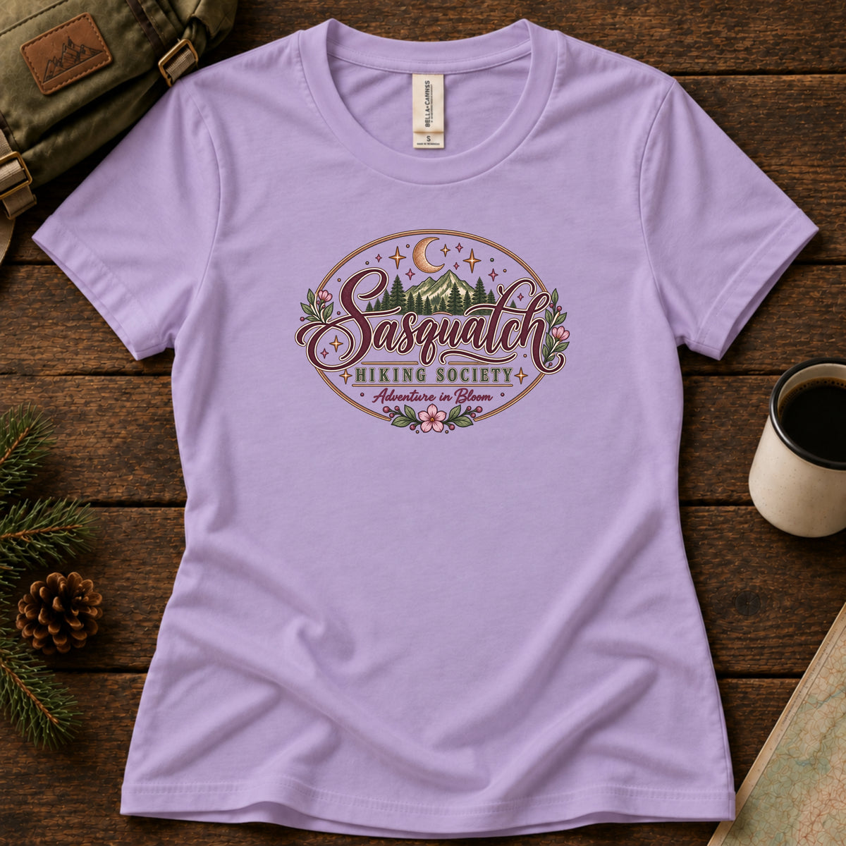 Adventure in Bloom women's graphic tee in Dark Lavender, Sasquatch Hiking Society.