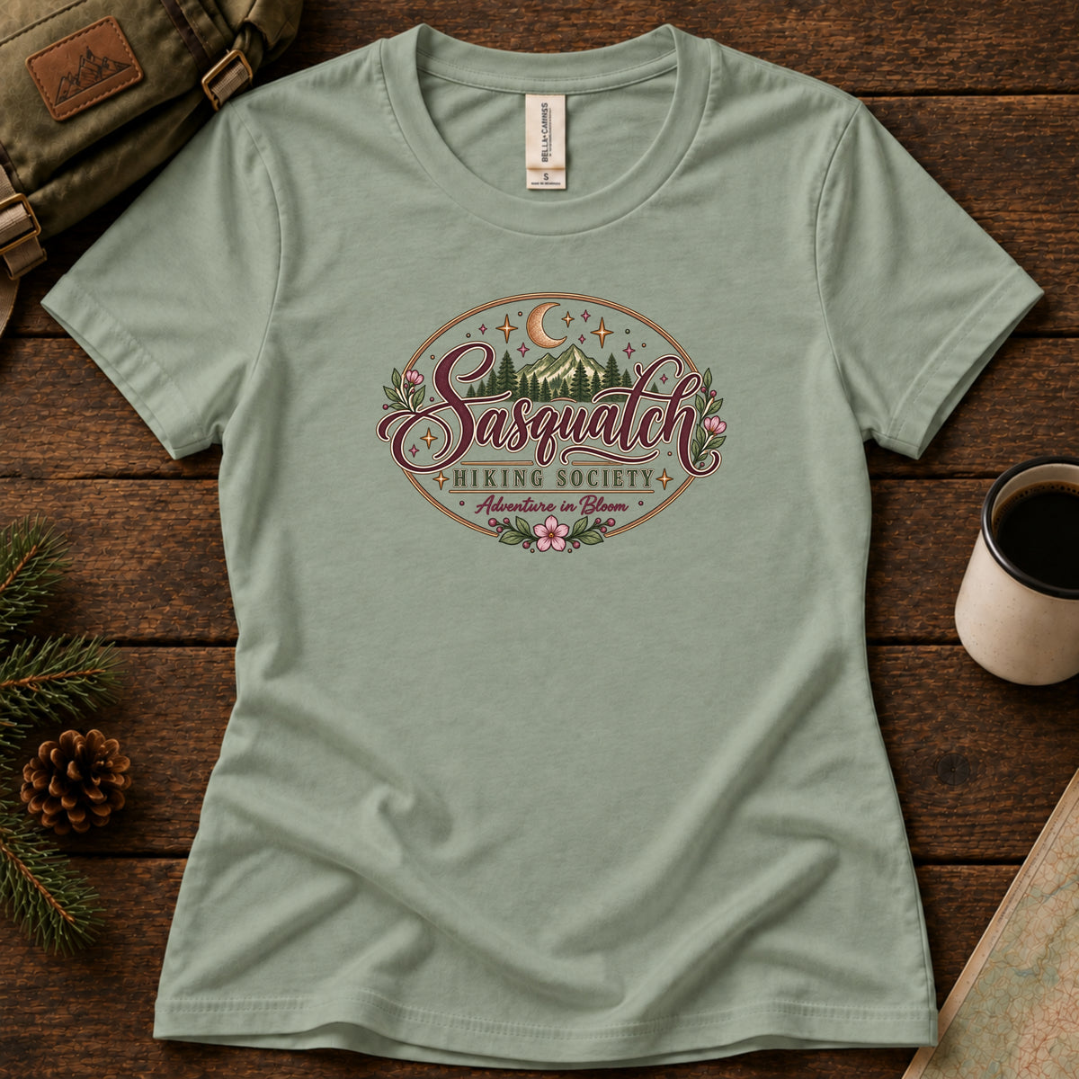 Adventure in Bloom women's graphic tee in Sage, Sasquatch Hiking Society.