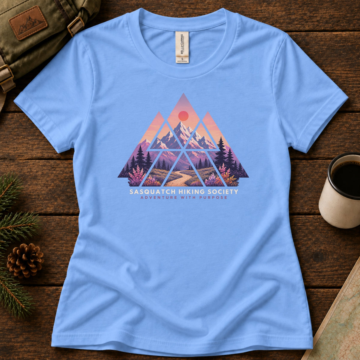 Adventure with Purpose women's graphic tee in Carolina Blue, Sasquatch Hiking Society.