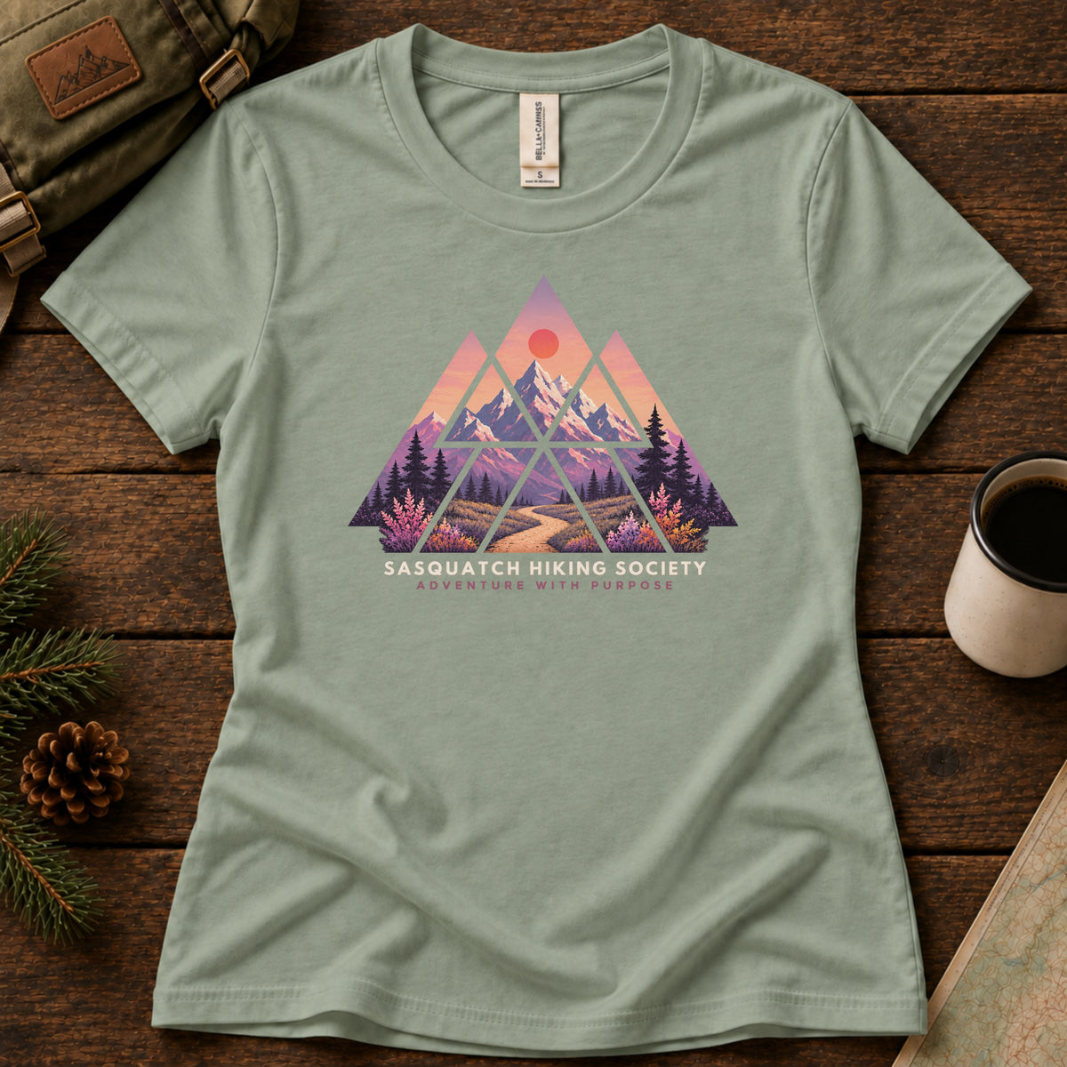 Adventure with Purpose women's graphic tee in Sage, Sasquatch Hiking Society.