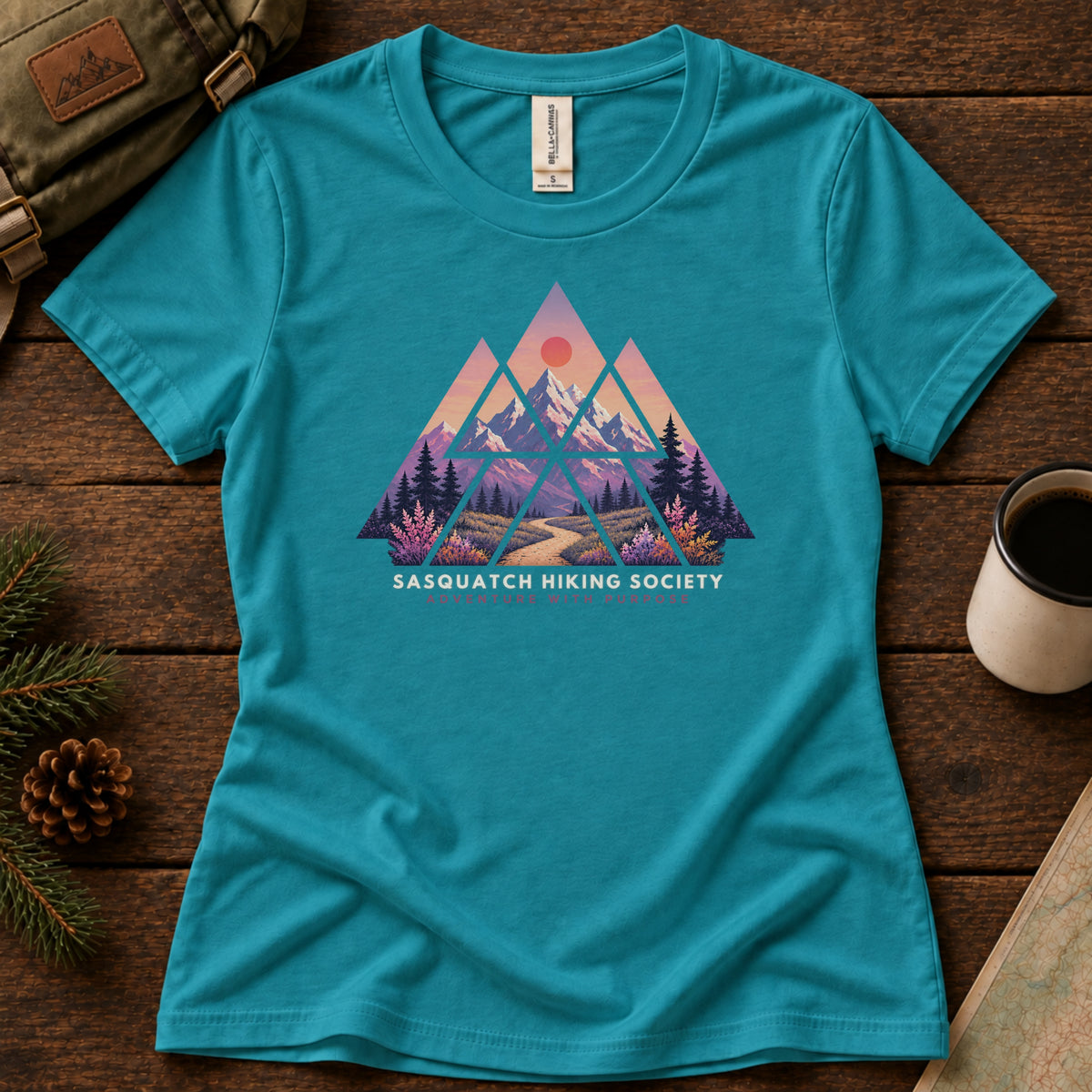 Adventure with Purpose women's graphic tee in Teal, Sasquatch Hiking Society.